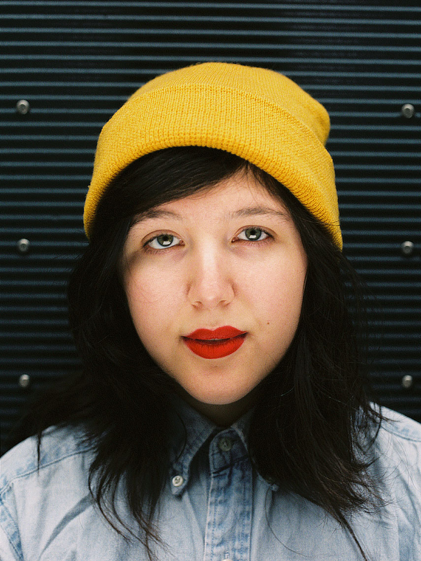Lucy Dacus in a yellow beanie
